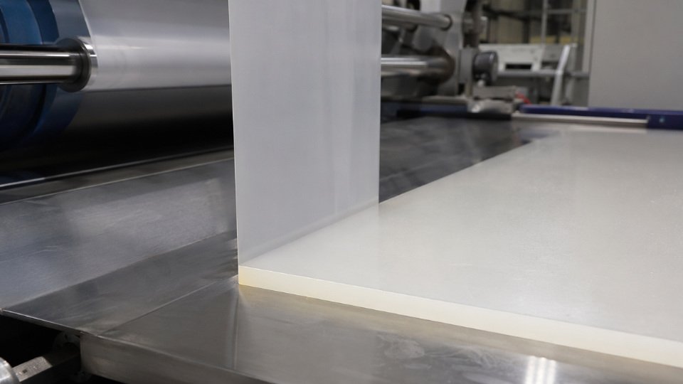 Polypropylene release film being peeled cleanly from a cured liquid silicone rubber sheet on a production line converting table